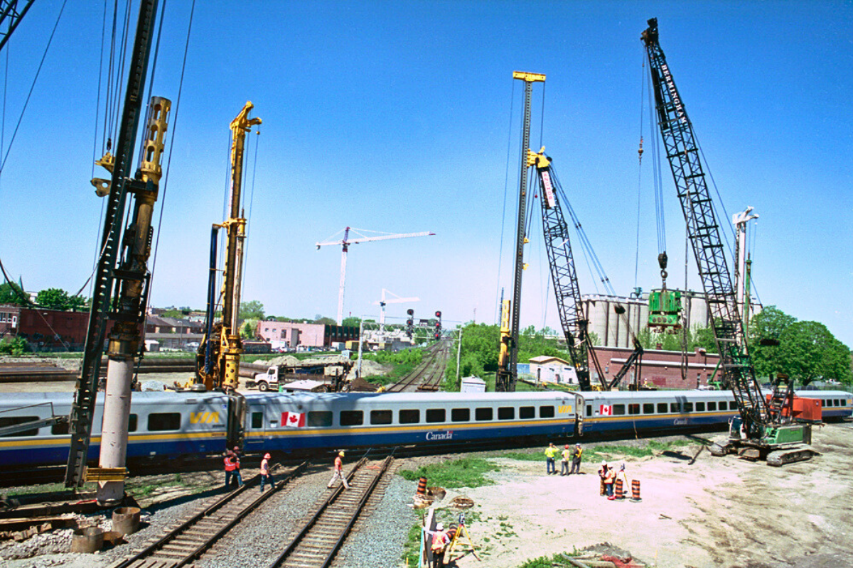 Construction site on a railway with a train passing
