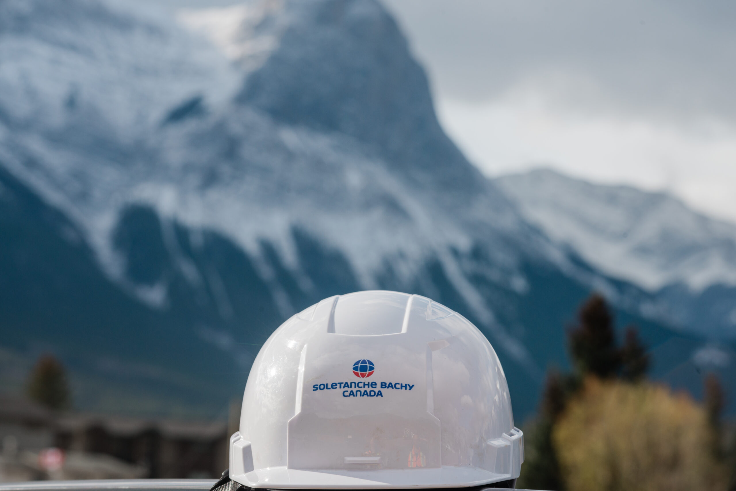 scenic photos of a hardhat with mountains behind
