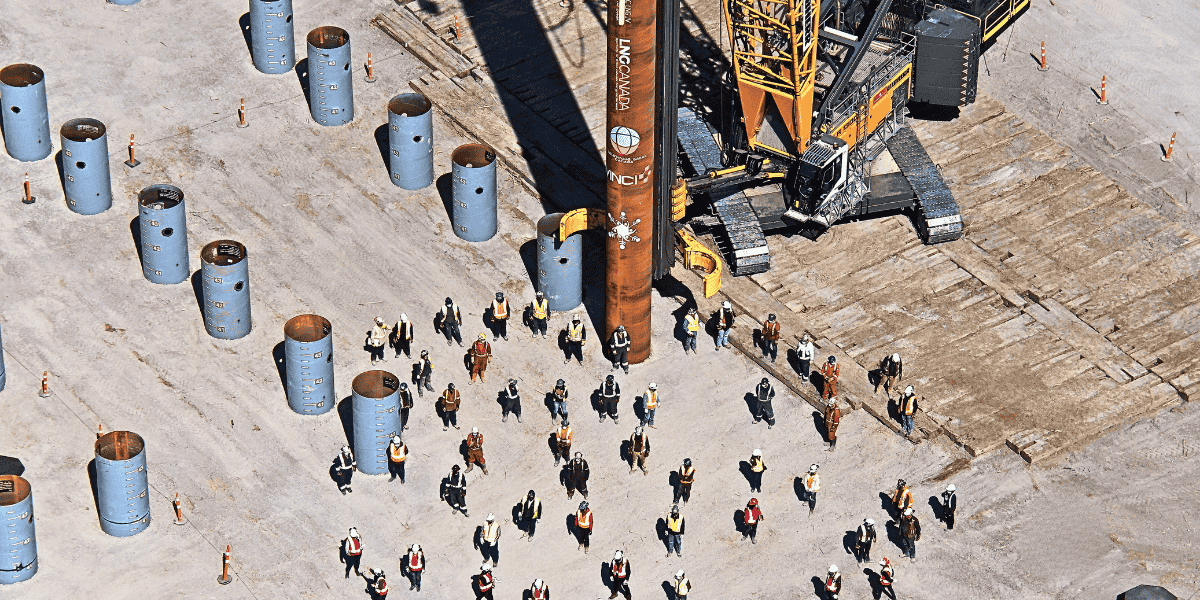 Drone photo from above of a project in Kitimat by Soletanche Bachy Canada showcasin a group of people and piles instalation