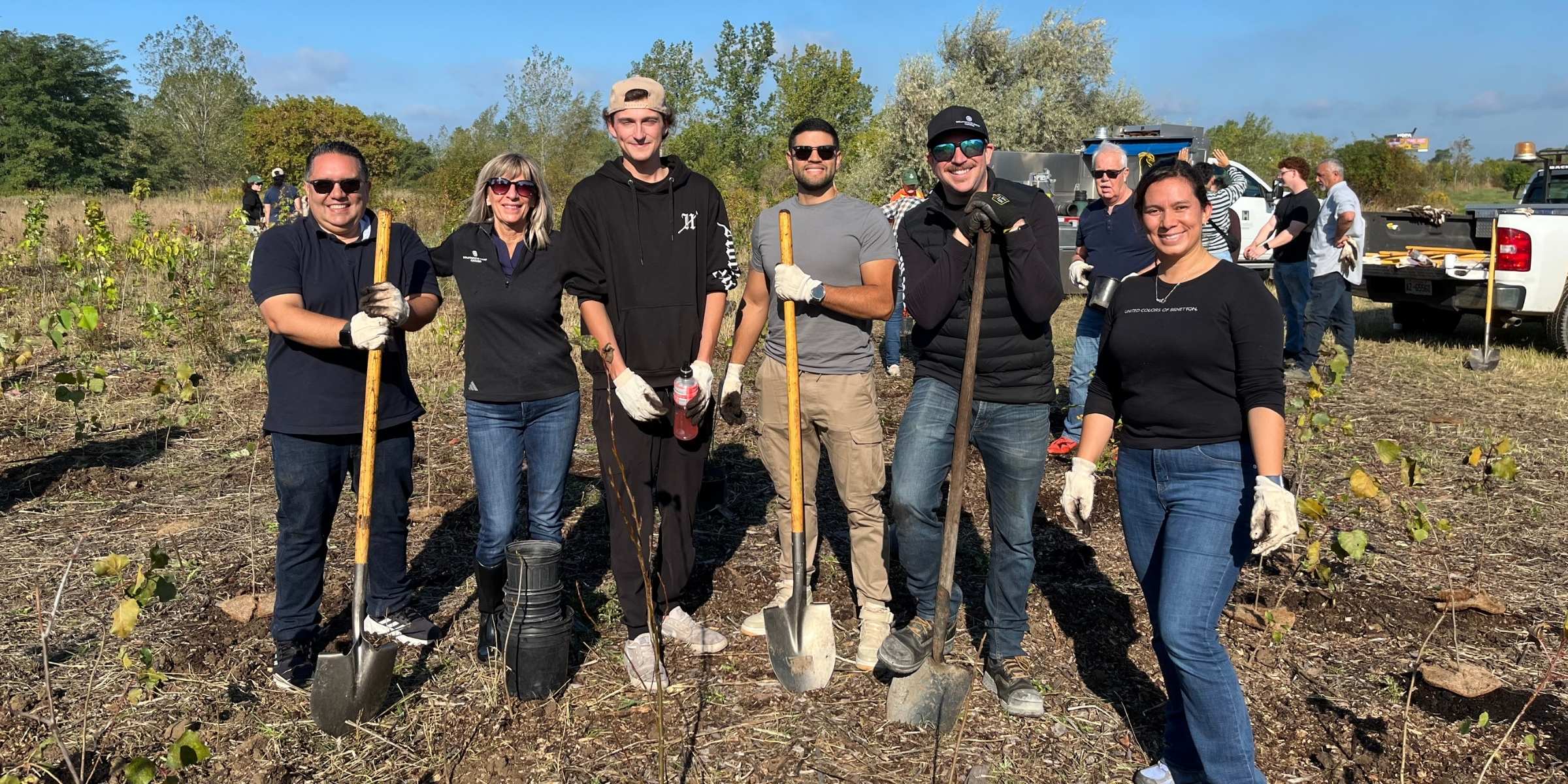 Group photo with six SB Canada team members from a tree planting event in Hamilton